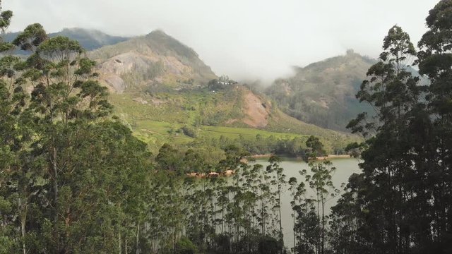 Aerial view beautiful nature with mountains and hills by Lake Mattupetty. Kerala State. Near the city of Munar.