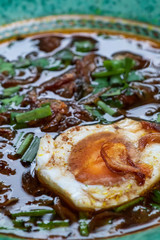rawon. Indonesian traditional food served with buffalo meat and salted eggs, smeared with black sauce and very tasty