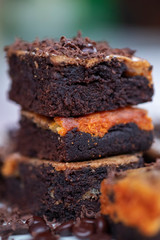 close up detail of homemade chocolate brownies with toppings of grains and grated chocolate
