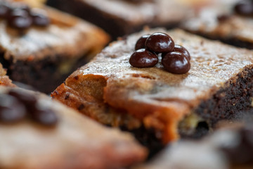 homemade chocolate brownies with toppings of grains and grated chocolate