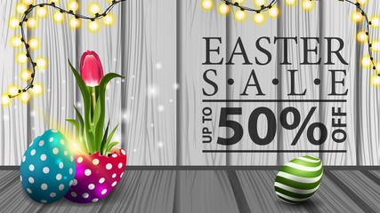 Easter sale, modern horizontal discount banner with wood texture, garland and tulip growing from Easter egg