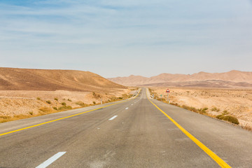 Fototapeta na wymiar Empty road somewhere in Negev Desert in Israel 