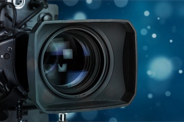 Professional video camera on dark background
