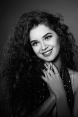 Beautiful woman face. Perfect makeup. Beauty fashion. Cosmetic. Eye shadow. Elegant Afro curly hairstyle. Black and white photo