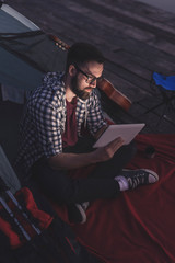 Digital nomad camping on the lake