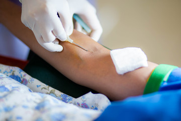 Blood donor at donation with a bouncy ball holding in hand, image for Thai Jan 2019