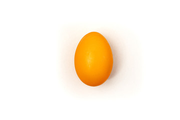 Orange painteded chicken egg isolated on the white background.