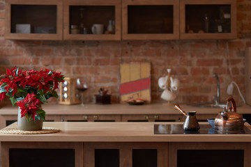 Loft kitchen space. Tea pot with coffee maker on tabletop.