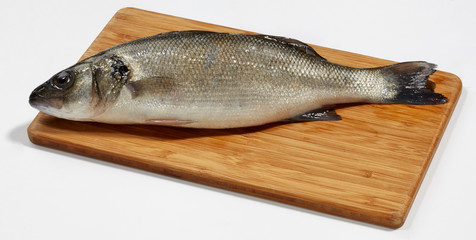 Fresh perch fish on wooden cutting board