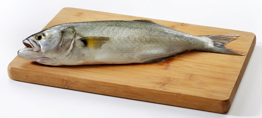 Fresh horse mackerel fish on wooden cutting board