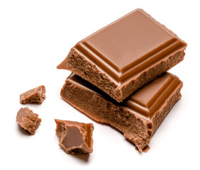 Milk organic chocolate pieces isolated on white background