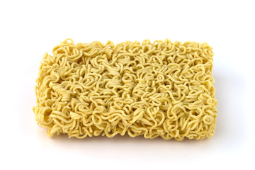 Egg noodles on a white background. Dry egg noodles close up on white background.