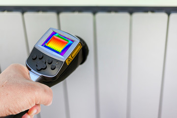 measuring the temperature of the heater using a thermal imager