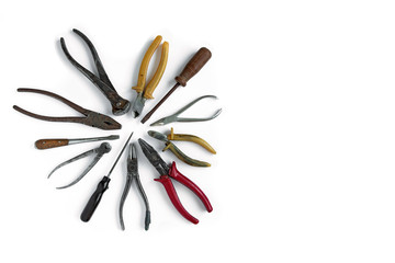 Old tools lie on a white isolated background. Chisels, wire cutters, screwdriver, pliers and other tools.