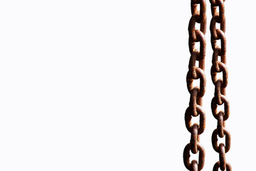 Rusty Steel chain hanging with iron beam in construction area
