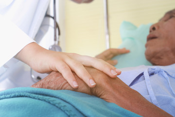 Doctors are visiting a patient.