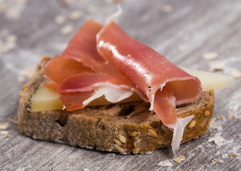 sandwich made with rye bread cheese and Parma ham