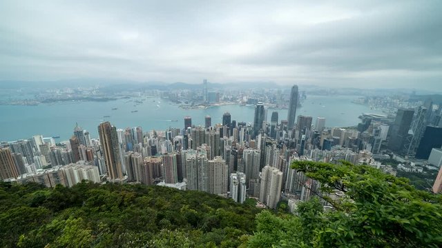 HONG KONG, CHINA - APRIL 2, 2019: 4K Cinematic Time Lapse Footage of Victoria Harbour taken from The Peak in Hong Kong during cloudy day.