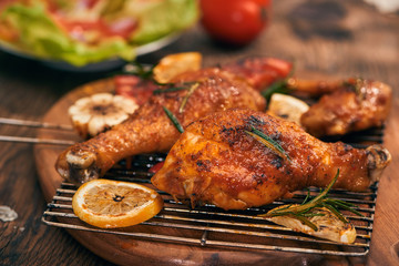 Grilled bbq chicken with fresh herbs and tomatoes