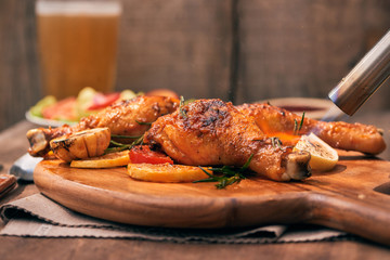 Chef cooking of Crispy Fried Chicken on wooden board background in the restaurants. Foods concept. Warm lights tone.