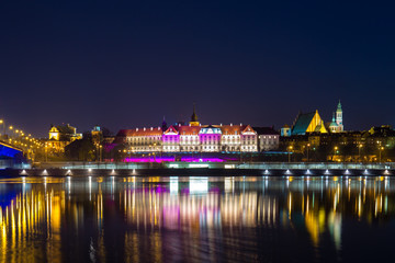 Night view from the Vistula river to the old city in Warsaw
