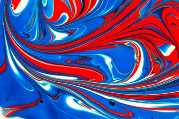 Abstract seamless background of red, white and blue liquid paint swirls