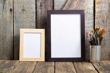 picture frame blank paper and paintbrushes at tin can