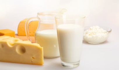 Dairy Products- Cheeses and Milk on the Grey Background