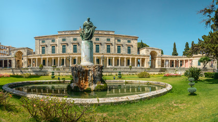 Corfu Museum of Asian Art, a statue in the garden with a pond.