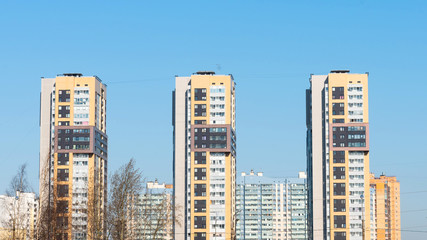 Fototapeta na wymiar urban landscape. high modern residential buildings against the blue sky