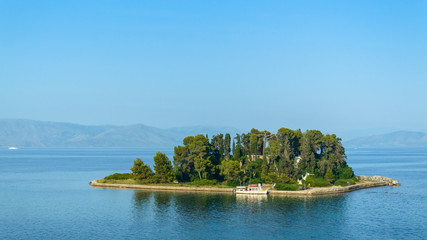 Fototapeta na wymiar Corfu, Kerkyra view from the coast at the Pantokrator church on the island of Pontikonisi.