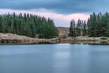 Sunset in Conemara lake with Pine Forest around