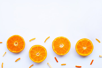 Orange with peels on white.