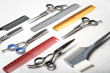 Seth barber accessories on a light background. Scissors and combs.