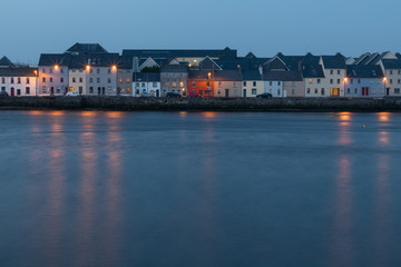 Fototapeta na wymiar Colored houses around Corrib river in Galway