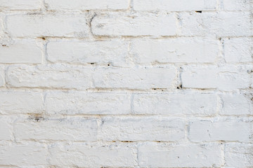 white wall, the rough brickwork of the wall.