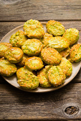 homemade baked scone cakes from fresh ramson leaves and cheese, old wooden texture