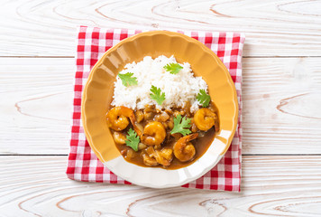 Shrimps in curry sauce on rice