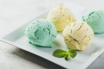 Ice cream with mint in ceramic bowl