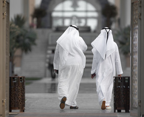 unidentifiable arabic men in white clothes