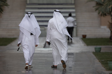 unidentifiable arabic men in white clothes