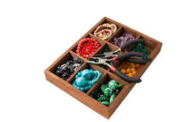 Beads from natural stones for making accessories in the box.