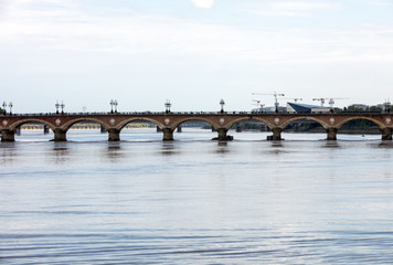 Fototapeta na wymiar The Pont de Pierre bridge crossing the river Garonne, Bordeaux, France