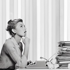 Attractive young woman speaking on vintage phone