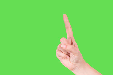 Closeup view of index finger of woman as if pressing invisible button or counting from one. Hand isolated on bright green mockup background. Horizontal color photography.