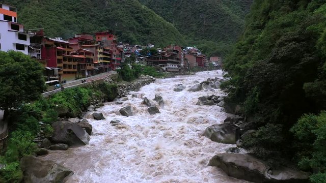 Aerial drone view of Aguas Calientes village and Urubamba river near Machu Picchu in Peru, South America.