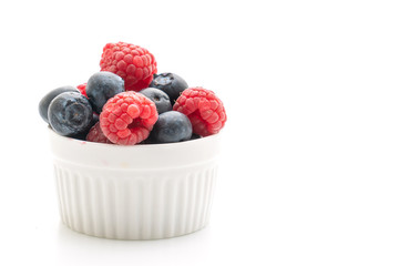fresh raspberries and fresh blueberries on white background
