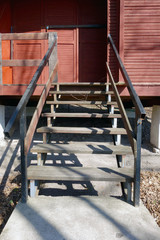 Fototapeta na wymiar Wooden stairs to the cottage