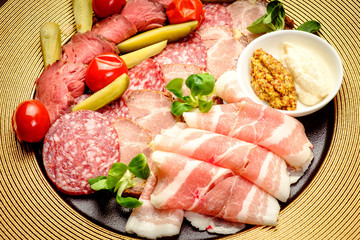 Party Platter of Assorted Cured Meats with sauce and pickles