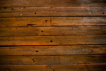 Naklejka premium The wall of wooden planks. Wooden background. The texture of the board. Wood texture
